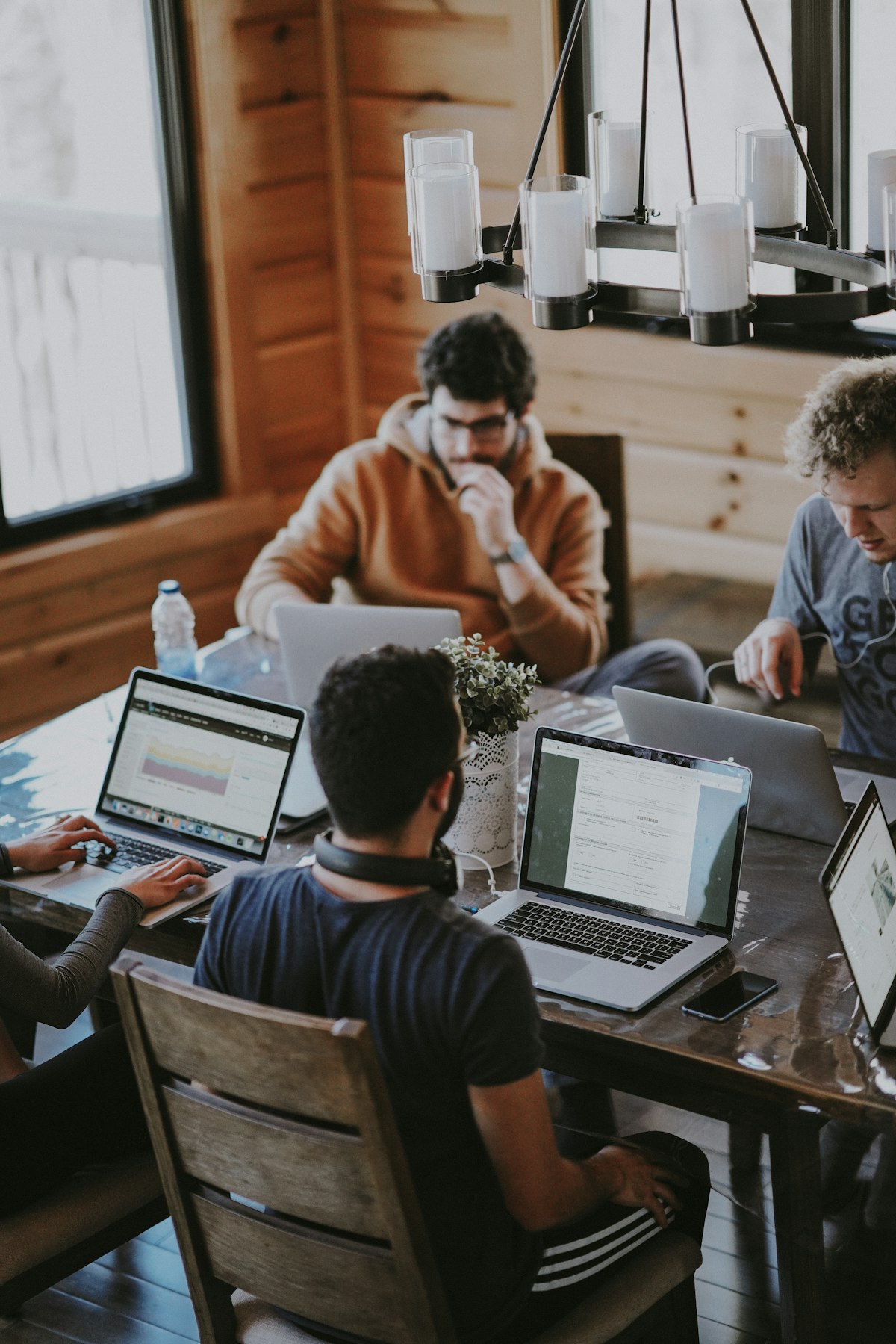 Colleagues standing together in a bright workspace